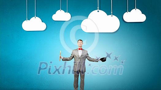 Young businessman in suit with hat and flute Young businessman in suit with hat and flute