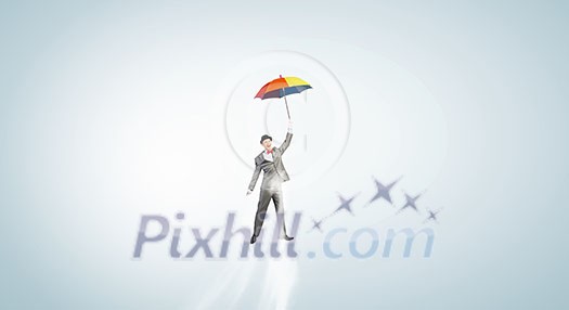 Businessman flying in sky on colorful umbrella Businessman flying in sky on colorful umbrella