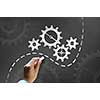 Businessman hand drawing with chalk gears mechanism as teamwork concept