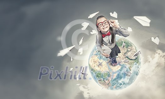 Wideangle picture of funny schoolgirl with paper plane. Elements of this image are furnished by NASA Wideangle picture of funny schoolgirl with paper plane. Elements of this image are furnished by NASA
