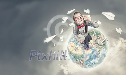 Wideangle picture of funny schoolgirl with paper plane. Elements of this image are furnished by NASA