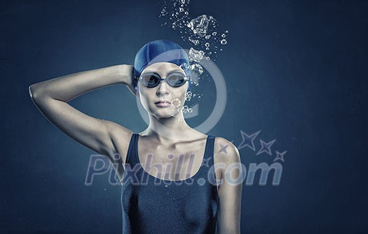 Portrait of woman swimmer in cap and glasses Portrait of woman swimmer in cap and glasses
