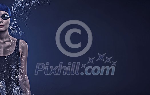 Portrait of woman swimmer in cap and glasses Portrait of woman swimmer in cap and glasses