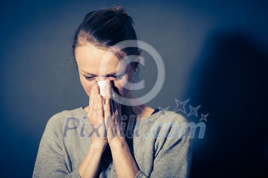 Young woman suffering from severe depression/anxiety/sadness, crying, tears coming from her eyes