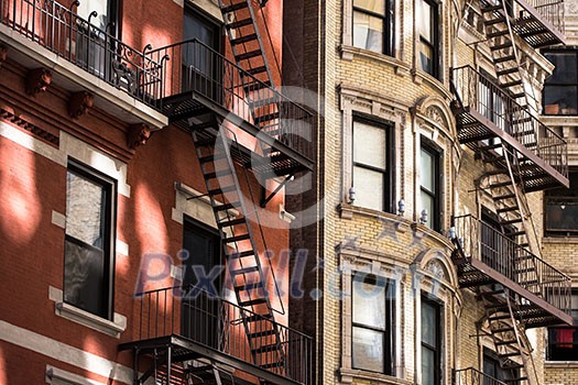 Old apartment building with fire escapes, Manhattan, New York City