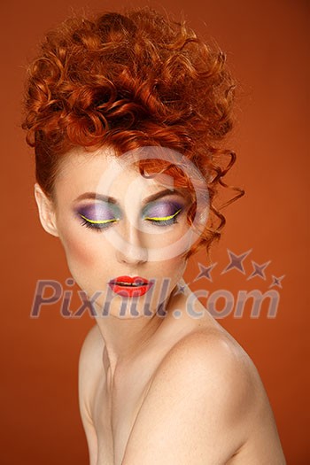 Red-haired. Beautiful girl with bright makeup.