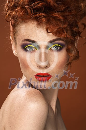 Red-haired. Beautiful girl with bright makeup. Ginger with freckles. Curly hair.