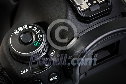 Professional modern DSLR camera - detail of the top LCD with settings - shutter speer, aperture, ISO, AF mode, battery info, RAW format indication,... Professional modern DSLR camera - detail of the top LCD with settings - shutter speer, aperture, ISO, AF mode, battery info, RAW format indication,...
