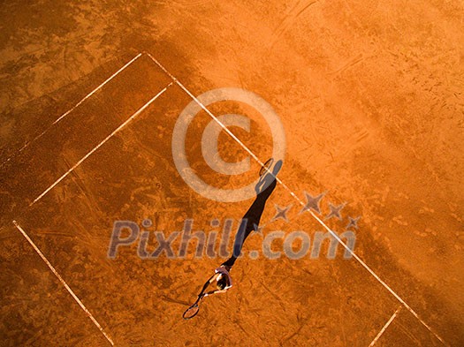 Aerial shot of a female tennis player on a court during match Aerial shot of a female tennis player on a court during match