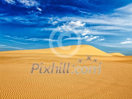 White sand dunes in desert on sunrise, Mui Ne, Vietnam.
