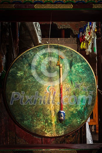 Large tibetan drum with beater in Hemis gompa (Tibetan Buddhist monastery). Ladakh, India