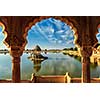 Indian landmark Gadi Sagar - artificial lake view through arch. Jaisalmer, Rajasthan, India