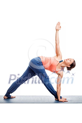 Woman doing Ashtanga Vinyasa yoga asana Parivrtta trikonasana - revolved triangle pose isolated on white Woman doing Ashtanga Vinyasa yoga asana Parivrtta trikonasana - revolved triangle pose isolated on white