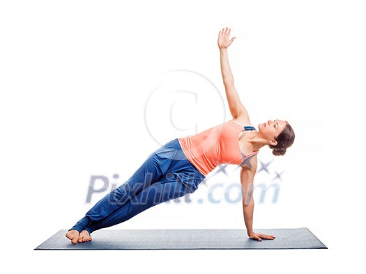 Beautiful sporty fit woman practices yoga asana Vasisthasana - side plank pose isolated on white Beautiful sporty fit woman practices yoga asana Vasisthasana - side plank pose isolated on white