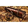 Travel geography navigation concept background - panorama of old vintage retro compass with sundial and spyglass on ancient world map