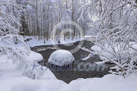 Northern river scenery in february with snow and ice