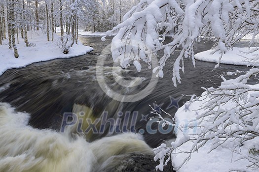 Northern river scenery in february with snow and ice Northern river scenery in february with snow and ice