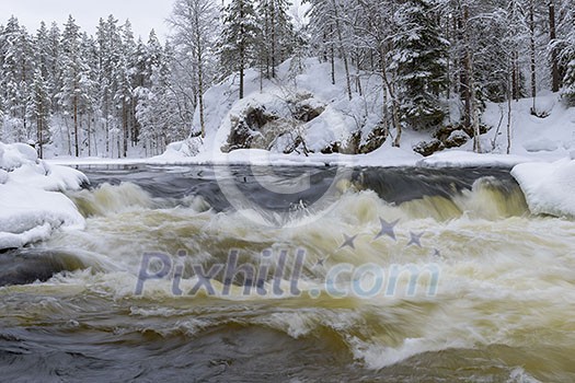 Northern river scenery in february with snow and ice