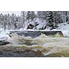 Northern river scenery in february with snow and ice