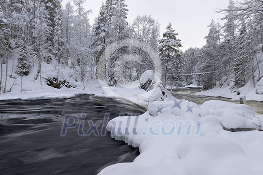 Northern river scenery in february with snow and ice Northern river scenery in february with snow and ice