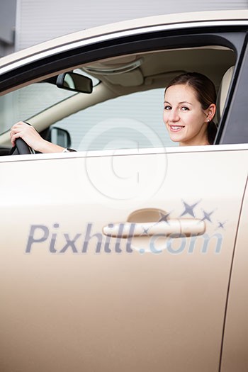 Pretty young woman driving her new car (color toned image;shallow DOF) Pretty young woman driving her new car (color toned image;shallow DOF)