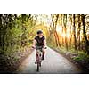 Senior man on his mountain bike outdoors (shallow DOF; color toned image)