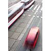 urban traffic concept - city street with a crossing, rail, motion blurred traffic