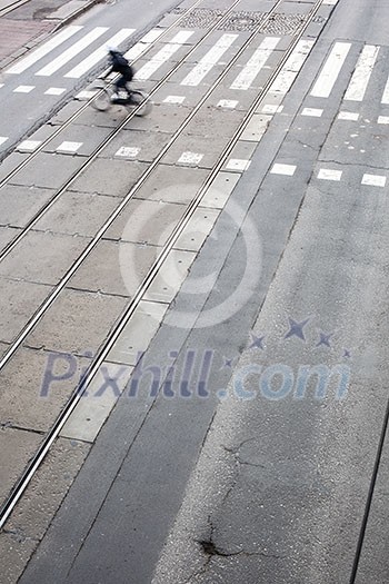 urban traffic concept - city street with a crossing, rail, motion blurred traffic urban traffic concept - city street with a crossing, rail, motion blurred traffic