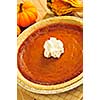 Whole pumpkin pie with fresh whipped cream