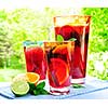 Refreshing fruit punch beverage in pitcher and glasses