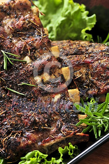 Plate of spare ribs and greens for dinner Plate of spare ribs and greens for dinner