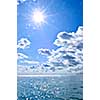 Blue ocean water and sunny sky background