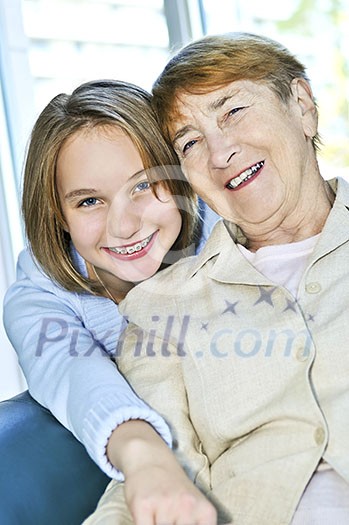 Granddaughter giving a hug to her grandmother