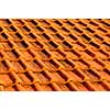Closeup of red clay interlocking roofing tiles background