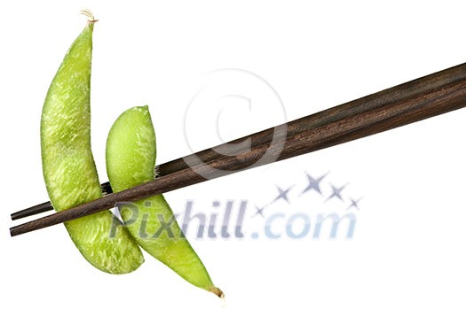 Edamame soy bean pods held by chopsticks Edamame soy bean pods held by chopsticks
