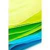 Close up of blue green and yellow tissue paper
