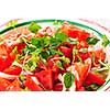 Summer tomato salad with onions and herbs