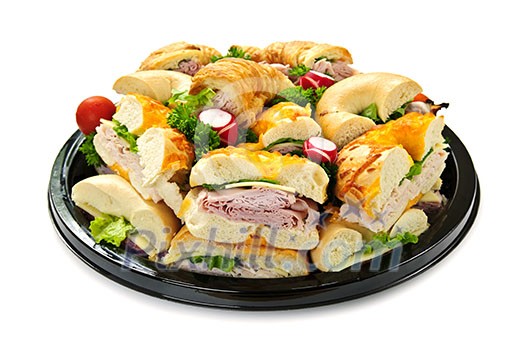 Isolated assorted platter of sandwiches with meat and vegetables