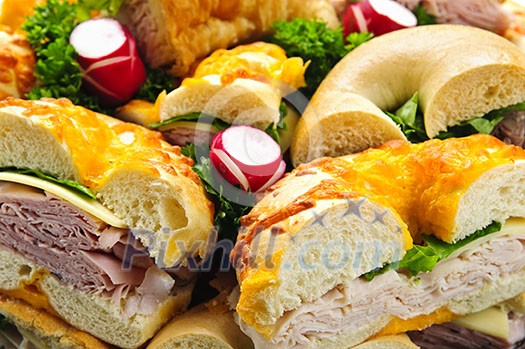 Assorted bagel sandwich platter with meat and vegetables