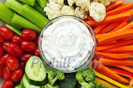Platter of assorted fresh vegetables with dip