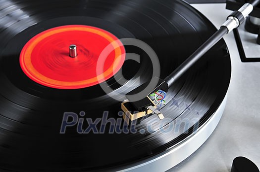 Vinyl record spinning on turntable close up Vinyl record spinning on turntable close up