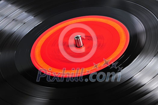 Vinyl record spinning on turntable close up Vinyl record spinning on turntable close up