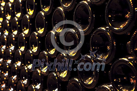 Large stack of wine bottle bottoms in winery