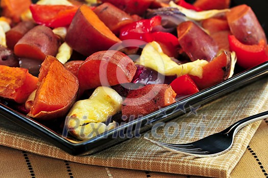 Vegetarian dish of roasted yams with cheese and peppers