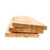 Three cedar one by six inch wood planks on white background