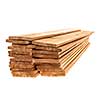 Stacks of one by six inch cedar boards on white background
