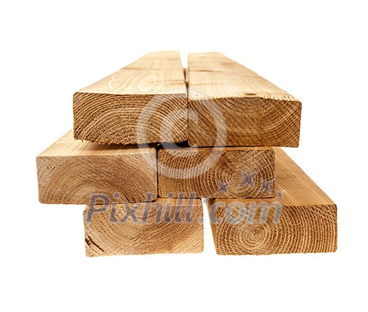 Edge of six cedar two by four lumber boards stacked on white background Edge of six cedar two by four lumber boards stacked on white background