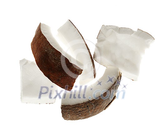 Several coconut kernel chunks isolated on white background