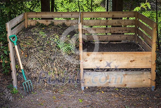 Large cedar wood compost boxes with composted soil and yard waste for backyard composting Large cedar wood compost boxes with composted soil and yard waste for backyard composting