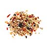Pile of homemade granola with various seeds and berries shot from above isolated on white background